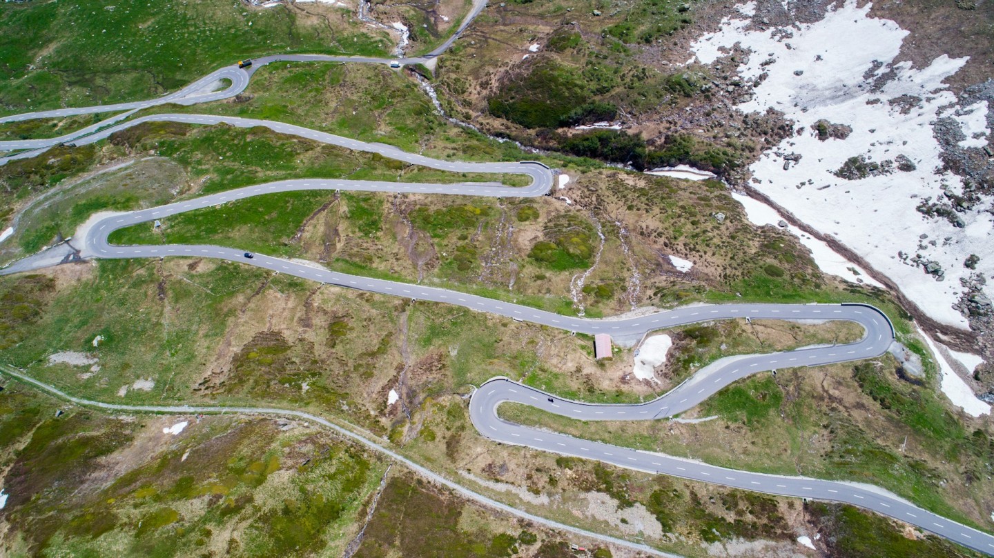 Photo credit: Manuel Boxler &ndash; Aerial view of the road on Oberalp Pass in Switzerland.
